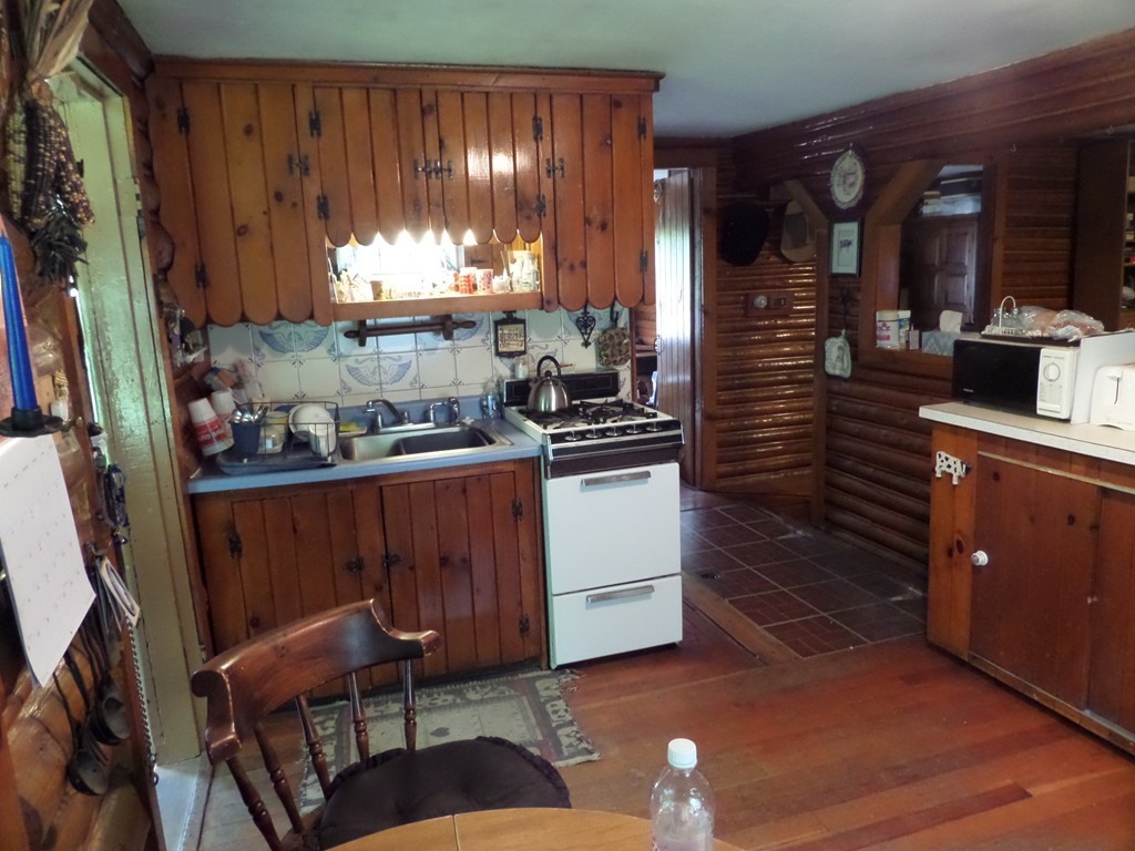 102 Fisk Road Worthington, MA 01098 - Photo 8 of 20 a kitchen with a sink and cabinets