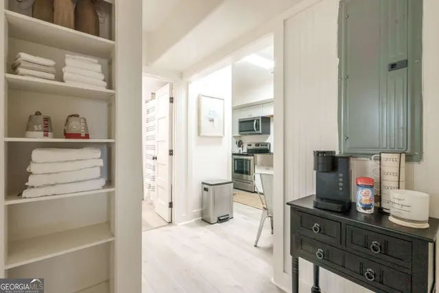 a kitchen with a refrigerator and cabinets