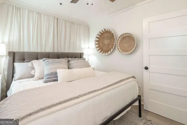 a bedroom with a bed and a chair