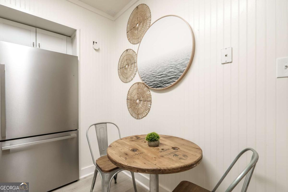 1413 2nd Avenue, Unit 4 Tybee Island, GA 31328 - Photo 20 of 32 a table and chairs in a kitchen