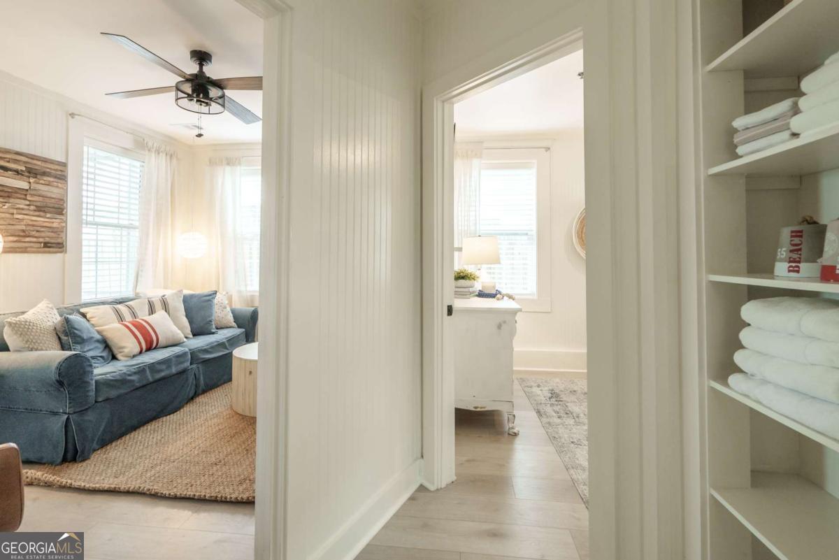 1413 2nd Avenue, Unit 4 Tybee Island, GA 31328 - Photo 25 of 32 a living room with furniture and a wooden floor