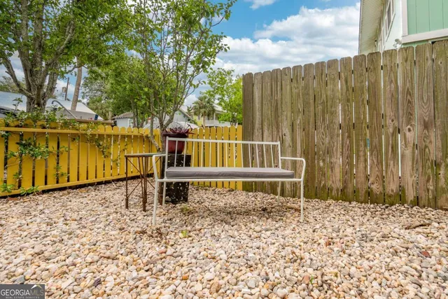a house with trees in the background