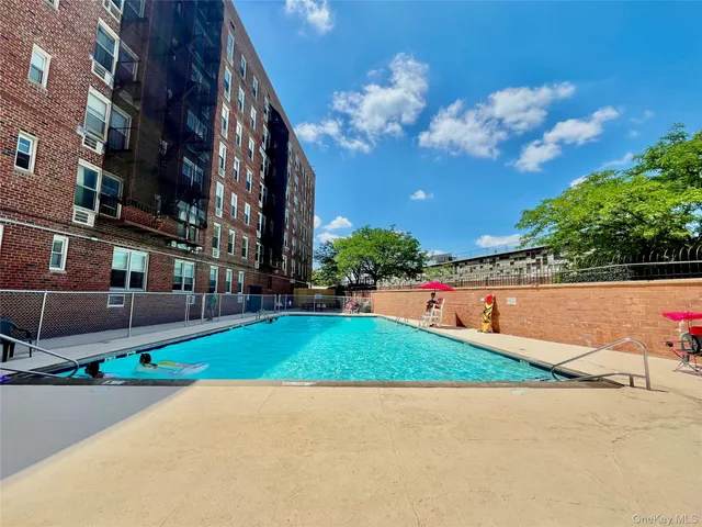 a view of a backyard with sitting area