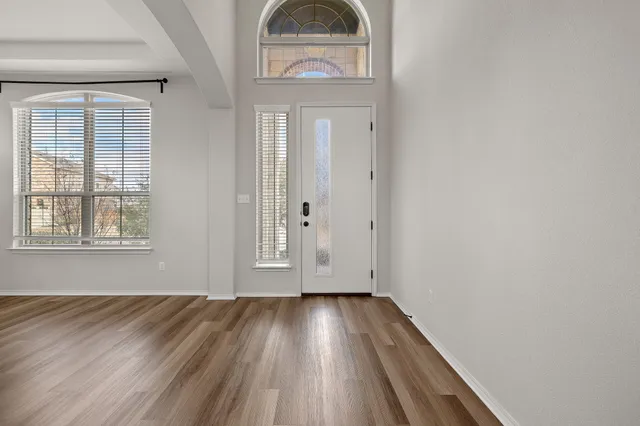 a view of front door with wooden floor