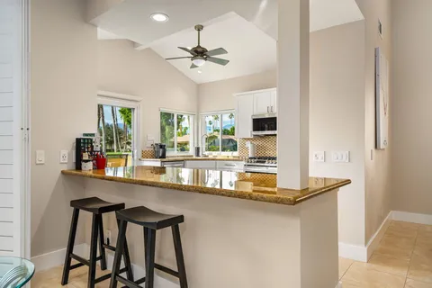a kitchen with a table and chairs in it