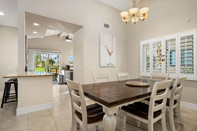 a view of a dining room with furniture and window