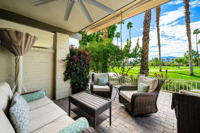 a outdoor living space with furniture and garden view