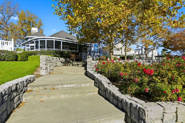 a view of a lake with a house in the background
