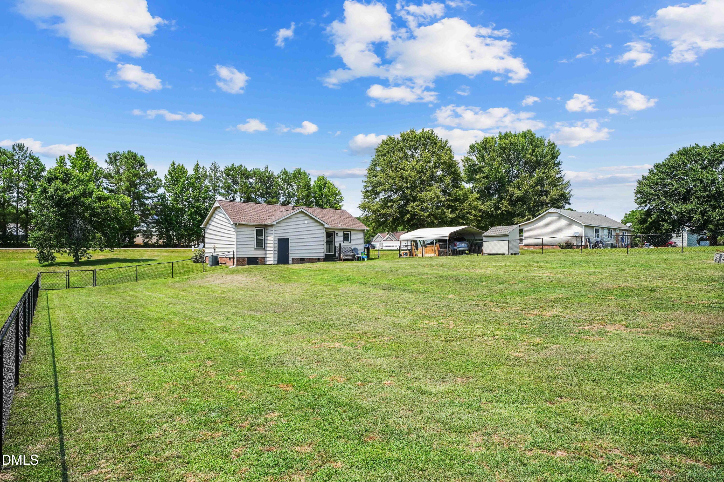 101 Stephenson Road Benson, NC 27504 - Photo 25 of 29 a view of a house with a big yard