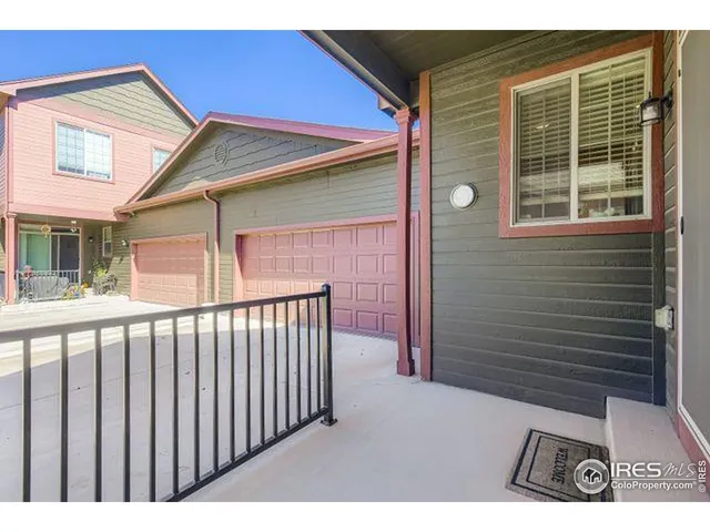a view of backyard with deck and wooden floor