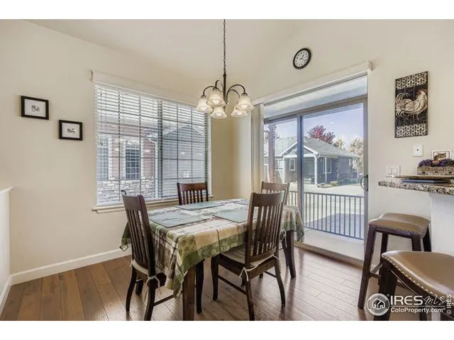 a view of a dining room with furniture and window