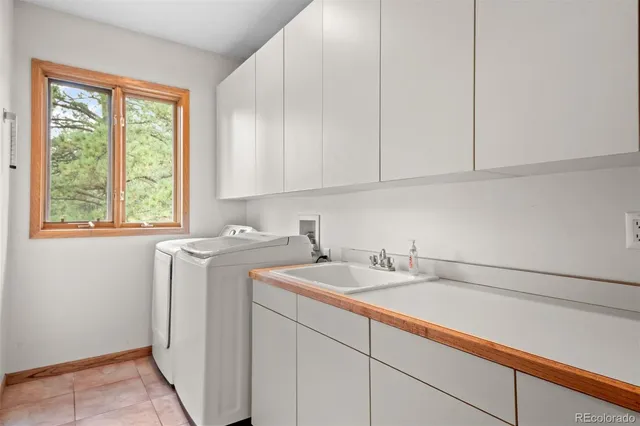 a view of storage and utility room with window