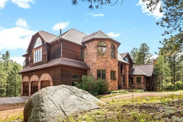 a front view of a residential apartment building with a yard