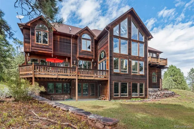 a aerial view of a house with a yard