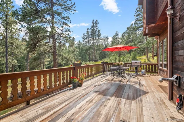 a wooden bench sitting in front of a building
