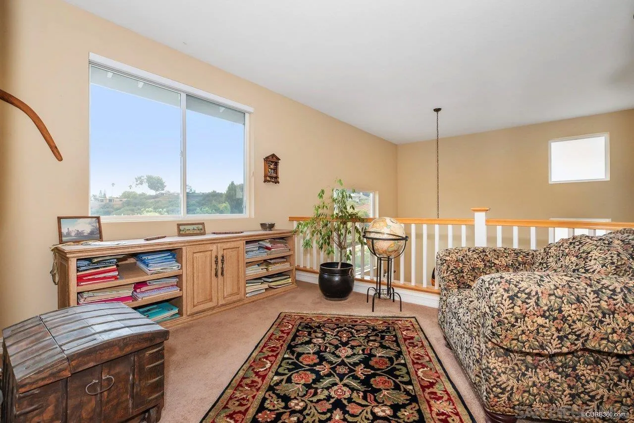 2451 Selkirk Row La Jolla, CA 92037 - Photo 15 of 37 a living room with furniture and a rug