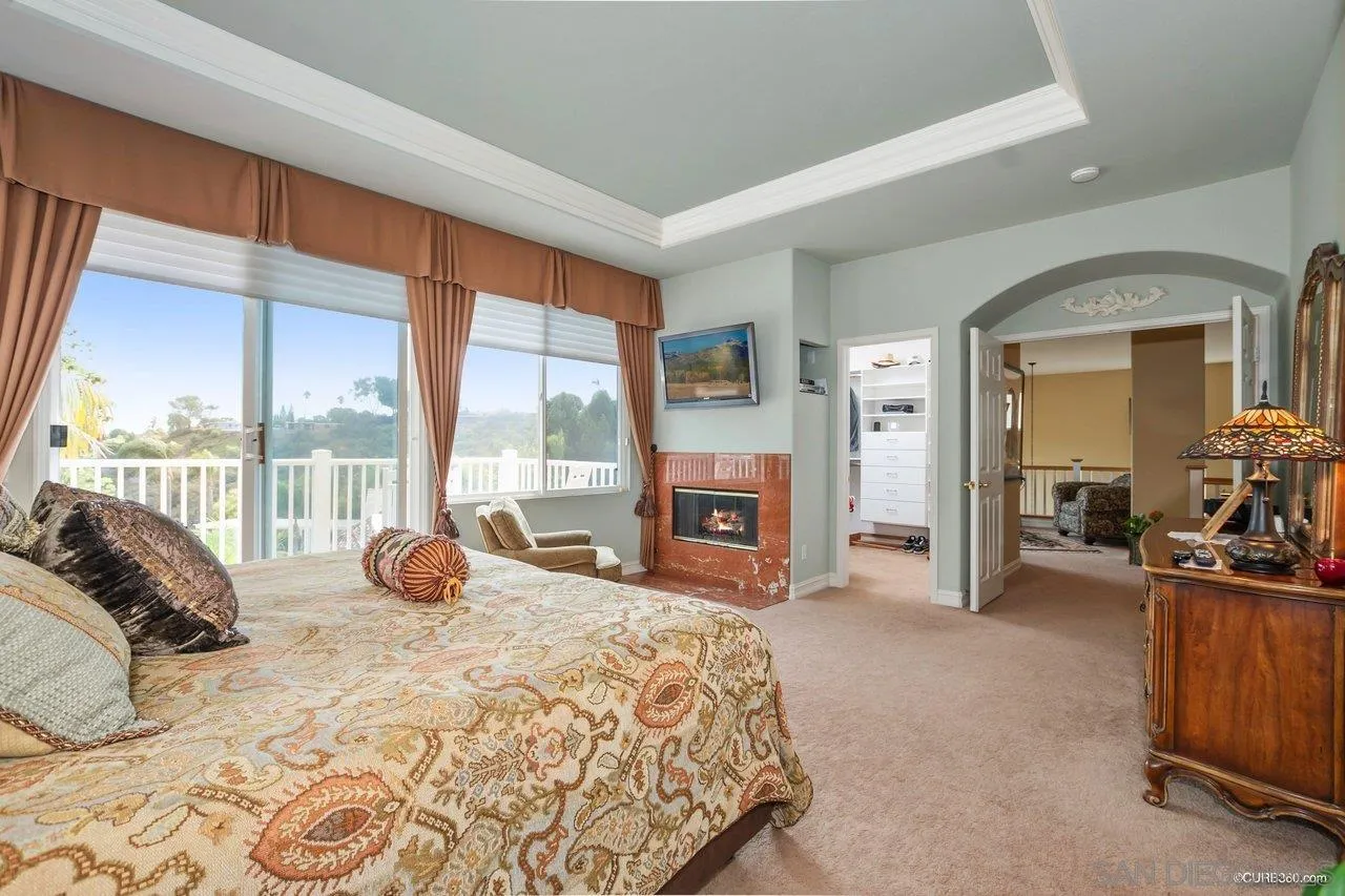 2451 Selkirk Row La Jolla, CA 92037 - Photo 17 of 37 a large bedroom with a bed and a large window