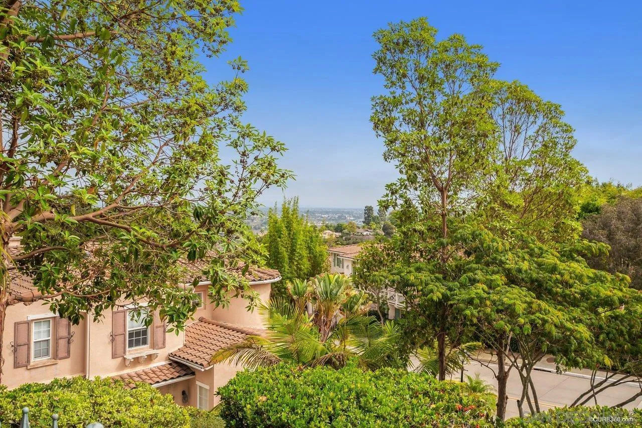2451 Selkirk Row La Jolla, CA 92037 - Photo 31 of 37 a yellow building with trees in front of it
