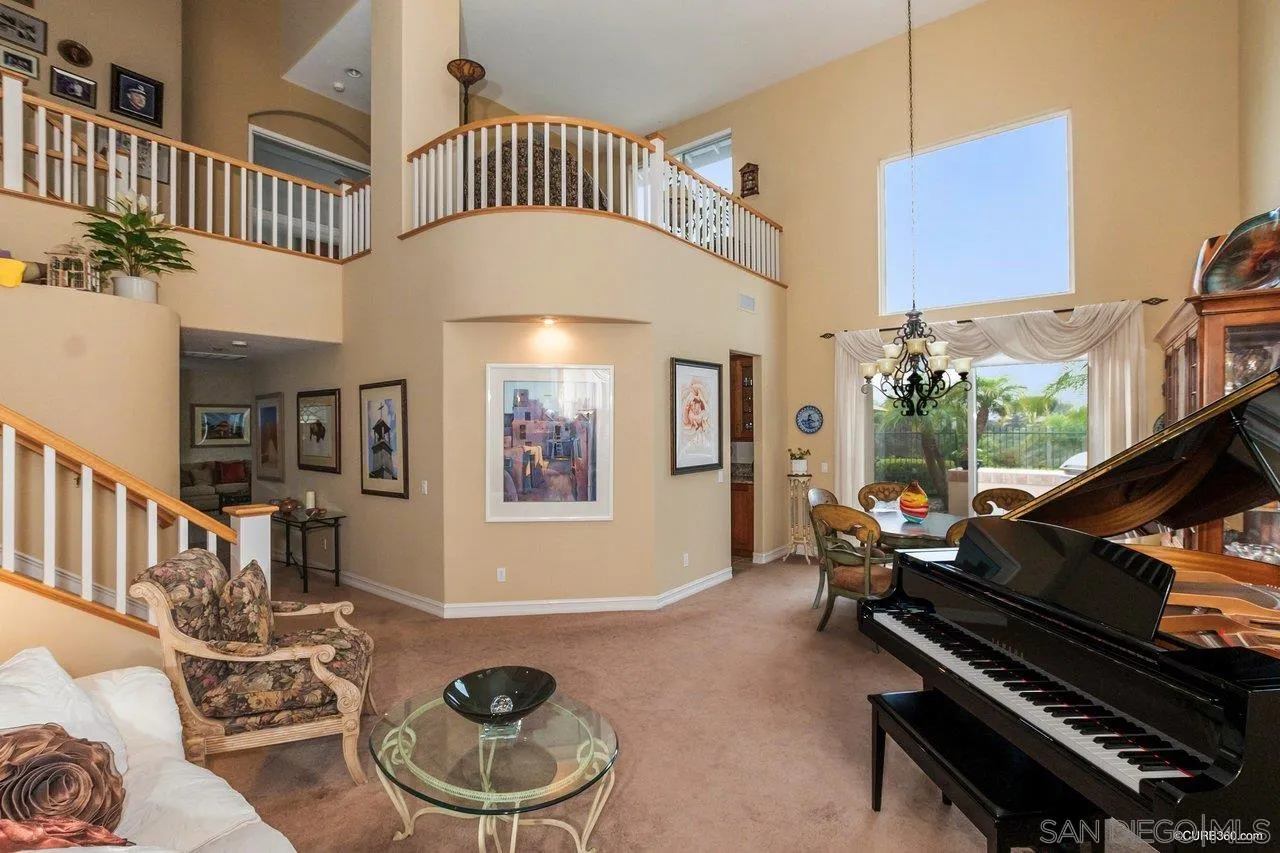 2451 Selkirk Row La Jolla, CA 92037 - Photo 4 of 37 a living room with furniture and a floor to ceiling window