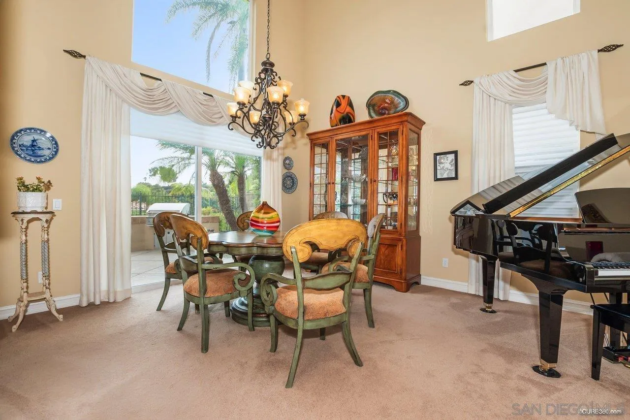 2451 Selkirk Row La Jolla, CA 92037 - Photo 5 of 37 a view of a dining room with furniture and chandelier