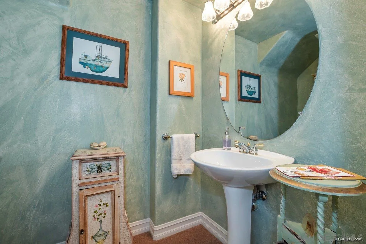 2451 Selkirk Row La Jolla, CA 92037 - Photo 8 of 37 a bathroom with a sink and a mirror