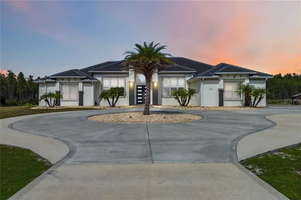 a front view of a house with garage