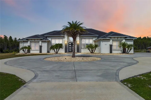 a front view of a house with garage