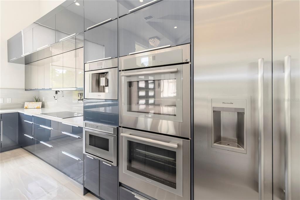 113 Spring Rise Circle Bunnell, FL 32110 - Photo 12 of 45 a kitchen with stainless steel appliances granite countertop a refrigerator and a stove top oven
