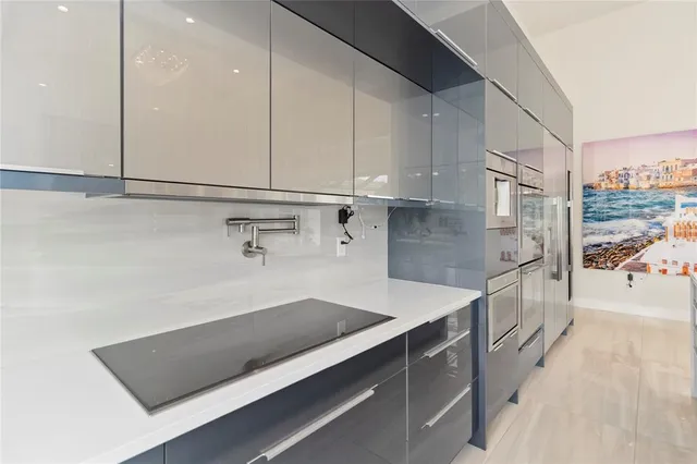 a kitchen with a sink and cabinets
