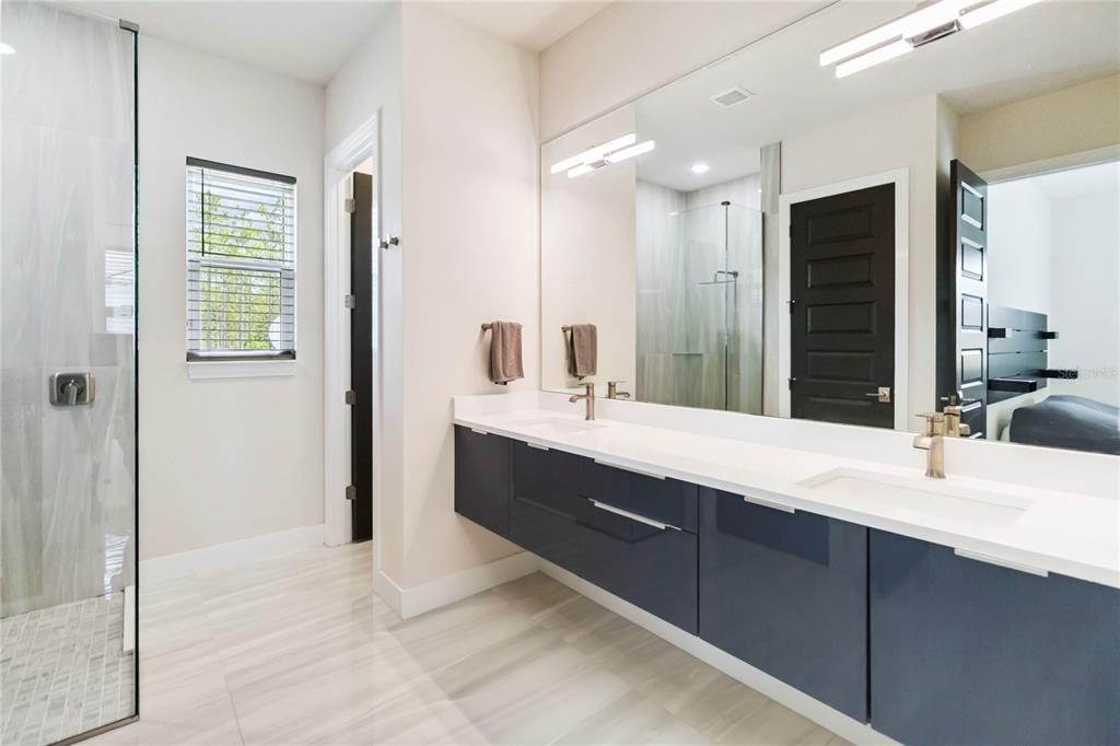 113 Spring Rise Circle Bunnell, FL 32110 - Photo 18 of 45 a bathroom with a double vanity sink mirror and double