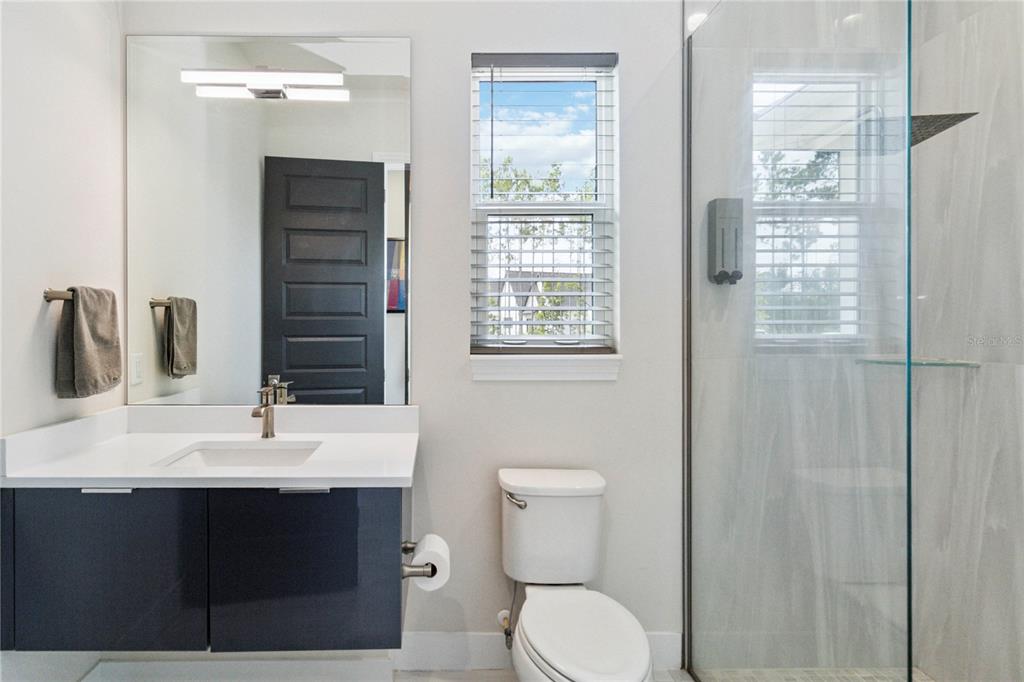 113 Spring Rise Circle Bunnell, FL 32110 - Photo 23 of 45 a bathroom with a sink a toilet and shower
