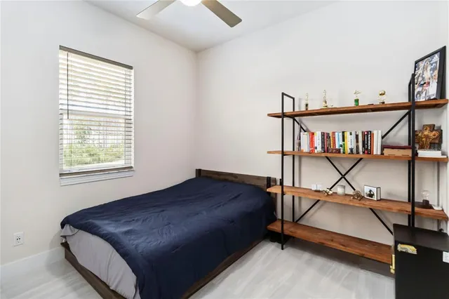 a bedroom with furniture and window