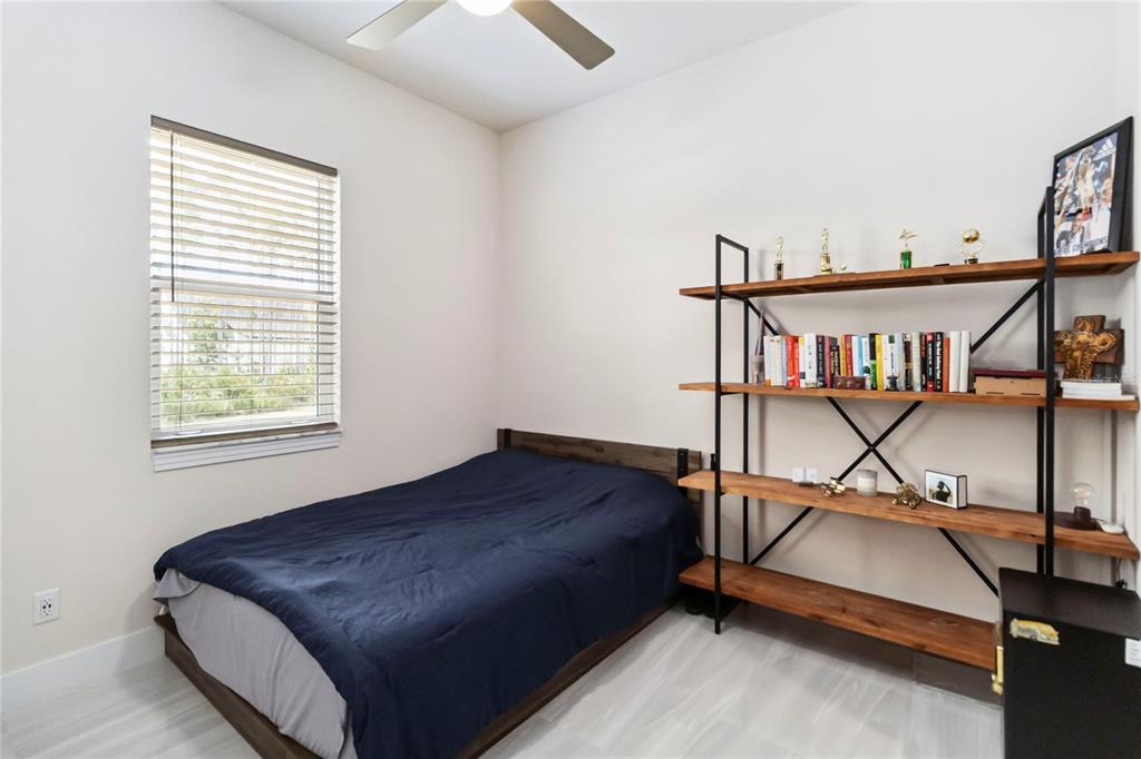 113 Spring Rise Circle Bunnell, FL 32110 - Photo 24 of 45 a bedroom with furniture and window