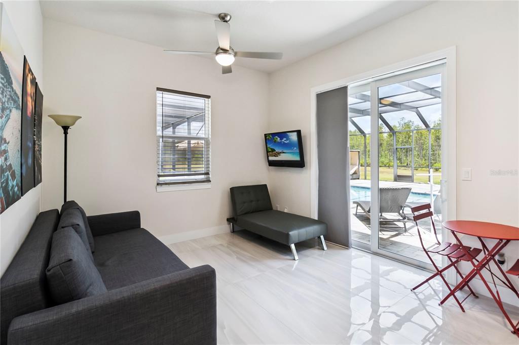 113 Spring Rise Circle Bunnell, FL 32110 - Photo 25 of 45 a living room with furniture and a window