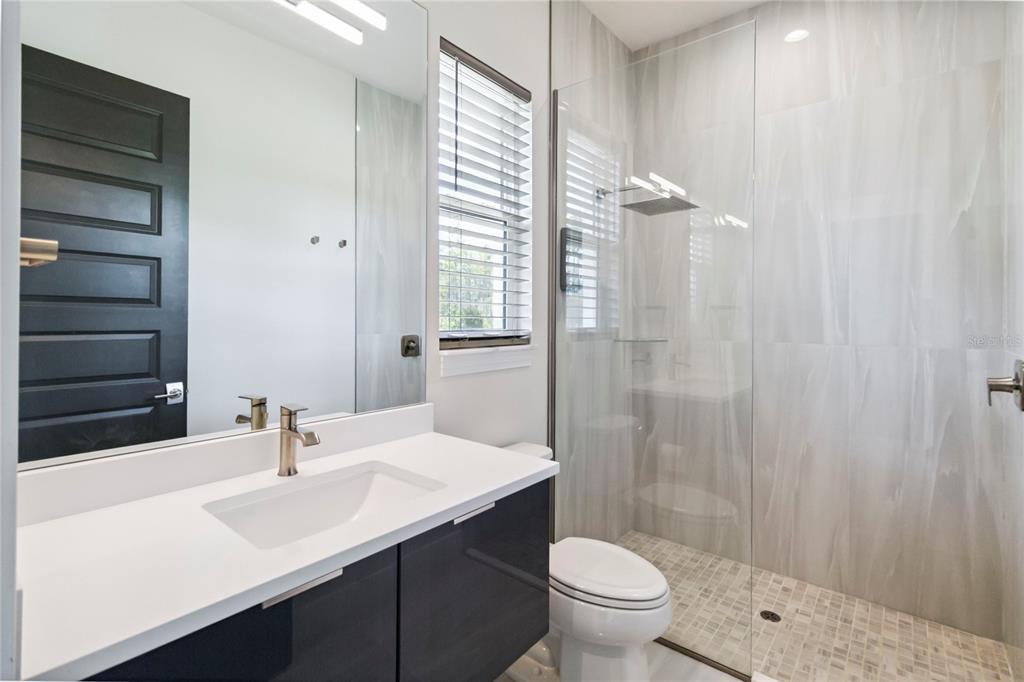 113 Spring Rise Circle Bunnell, FL 32110 - Photo 27 of 45 a bathroom with a sink a toilet and shower