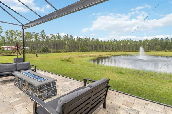 a view of a swimming pool and a yard