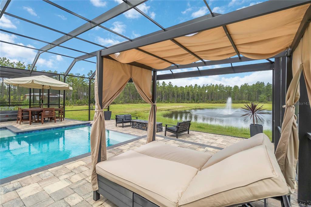 113 Spring Rise Circle Bunnell, FL 32110 - Photo 33 of 45 a view of a patio with a table and chairs