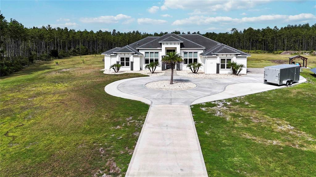113 Spring Rise Circle Bunnell, FL 32110 - Photo 41 of 45 a front view of a house with a yard