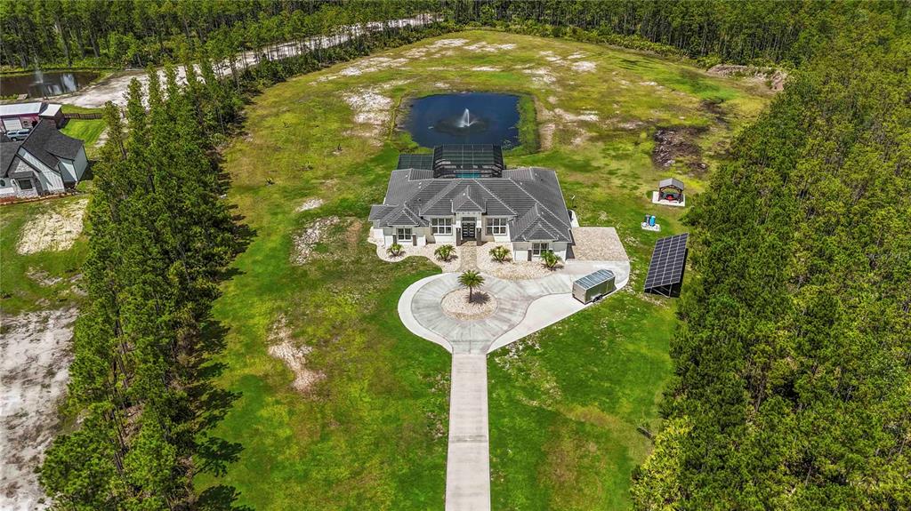 113 Spring Rise Circle Bunnell, FL 32110 - Photo 44 of 45 a view of a garden with a fountain