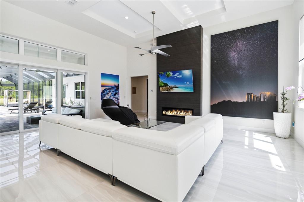 113 Spring Rise Circle Bunnell, FL 32110 - Photo 5 of 45 a living room with furniture and a flat screen tv