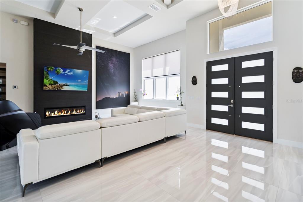 113 Spring Rise Circle Bunnell, FL 32110 - Photo 6 of 45 a living room with furniture and a flat screen tv