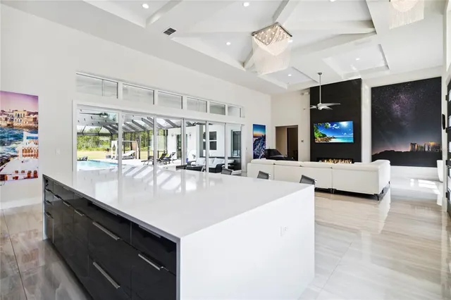 a kitchen with kitchen island a counter top space a sink and appliances