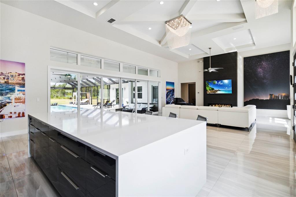 113 Spring Rise Circle Bunnell, FL 32110 - Photo 10 of 45 a kitchen with kitchen island a counter top space a sink and appliances