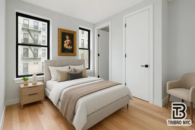 a bedroom with bed and a window