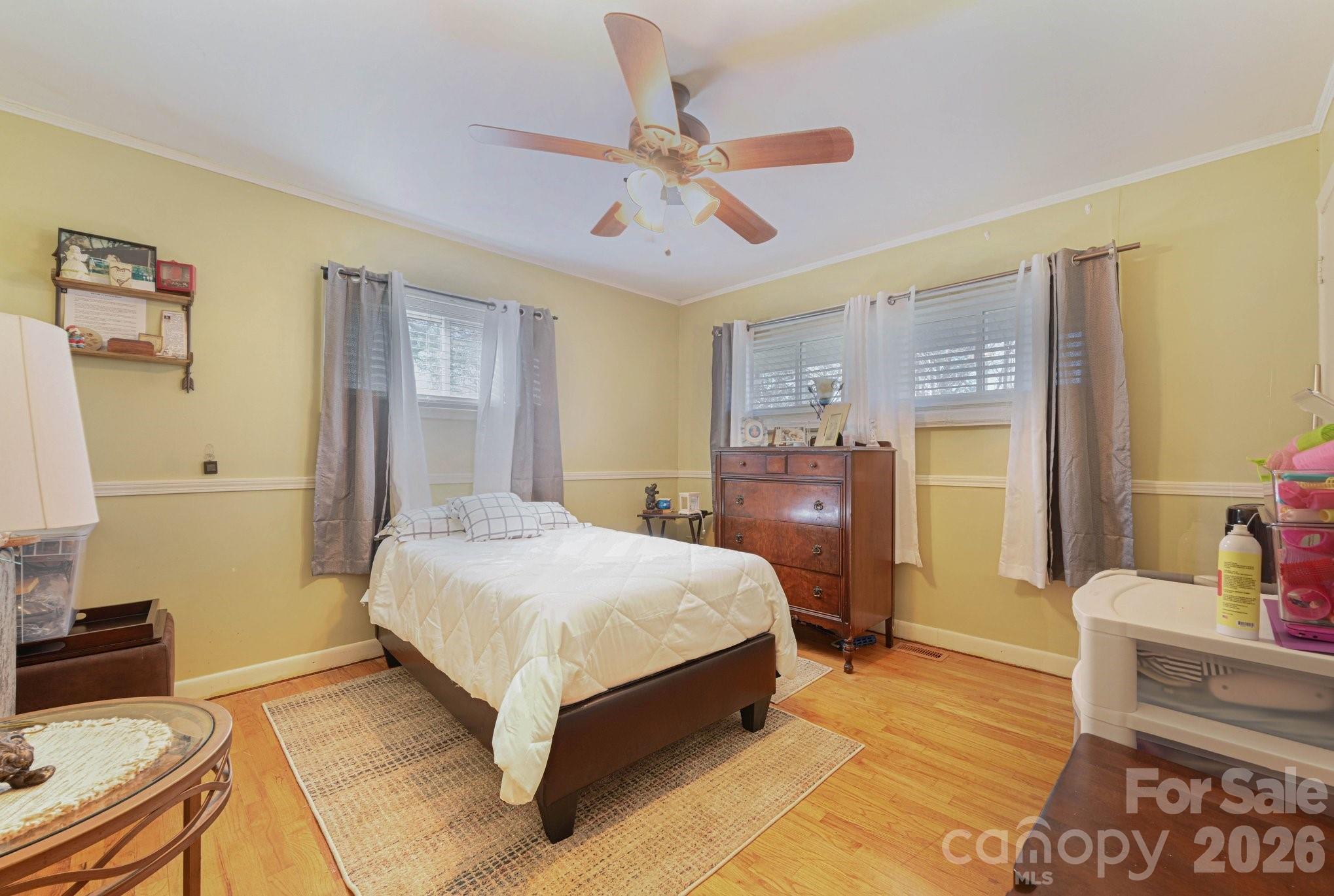 1107 Crestfield Drive Lancaster, SC 29720 - Photo 13 of 29 a bedroom with a bed and wooden floor
