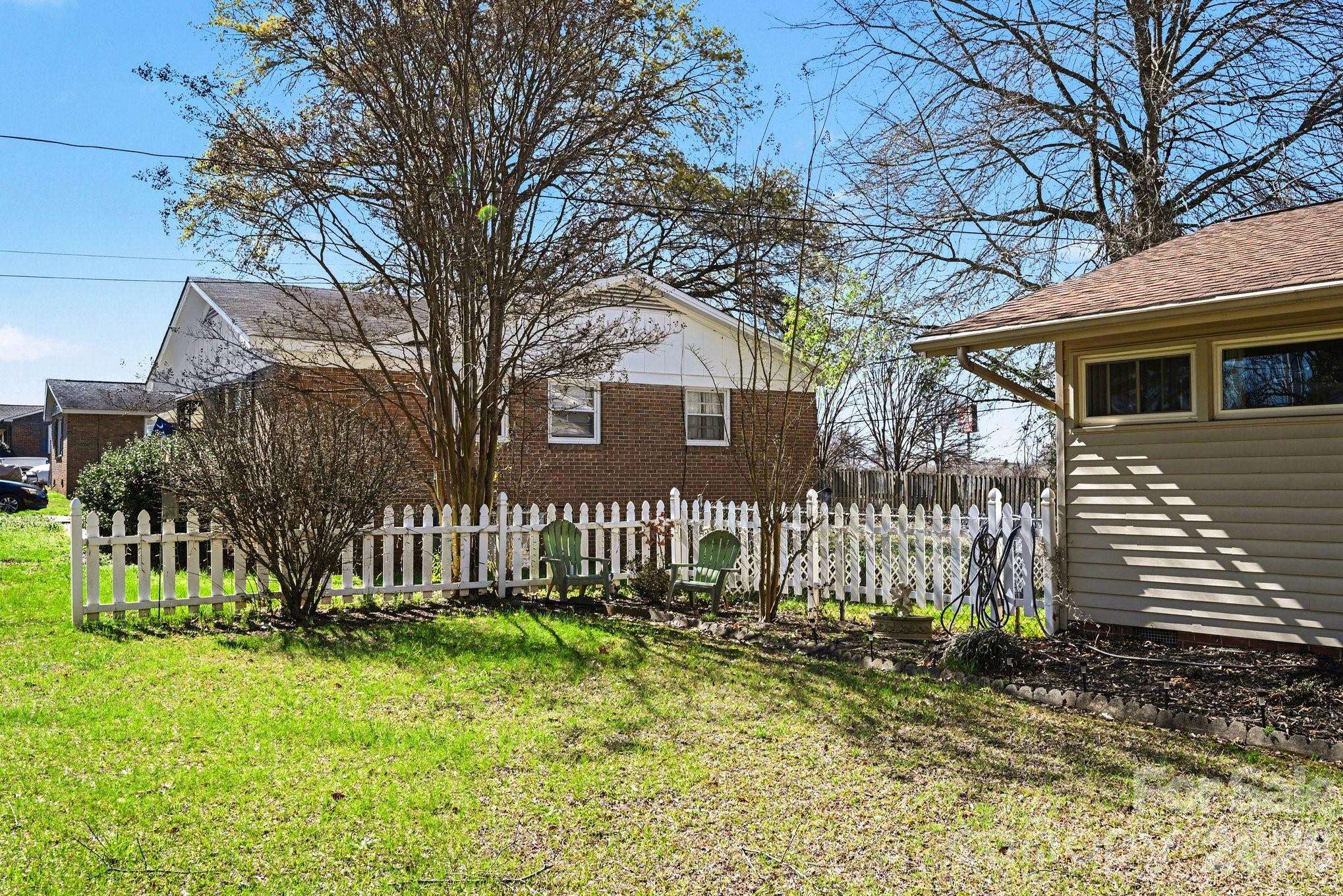 1107 Crestfield Drive Lancaster, SC 29720 - Photo 2 of 29 a front view of a house with a garden