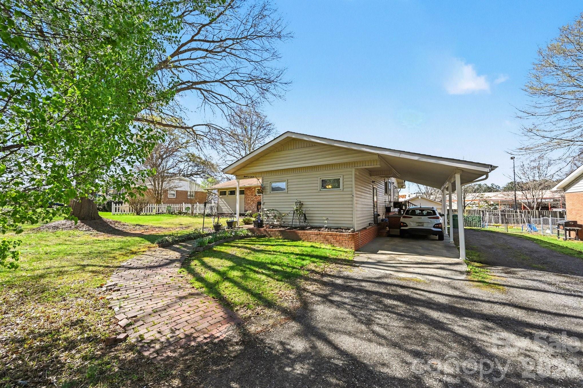 1107 Crestfield Drive Lancaster, SC 29720 - Photo 24 of 29 a view of a house with backyard and sitting area