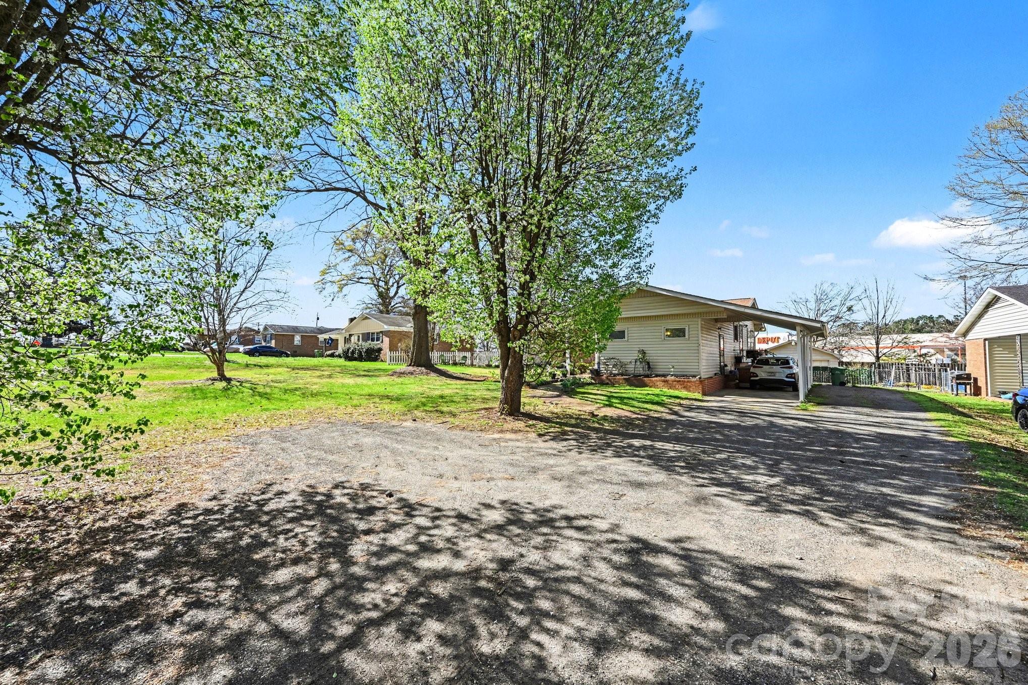 1107 Crestfield Drive Lancaster, SC 29720 - Photo 25 of 29 a view of a house with a yard and garage