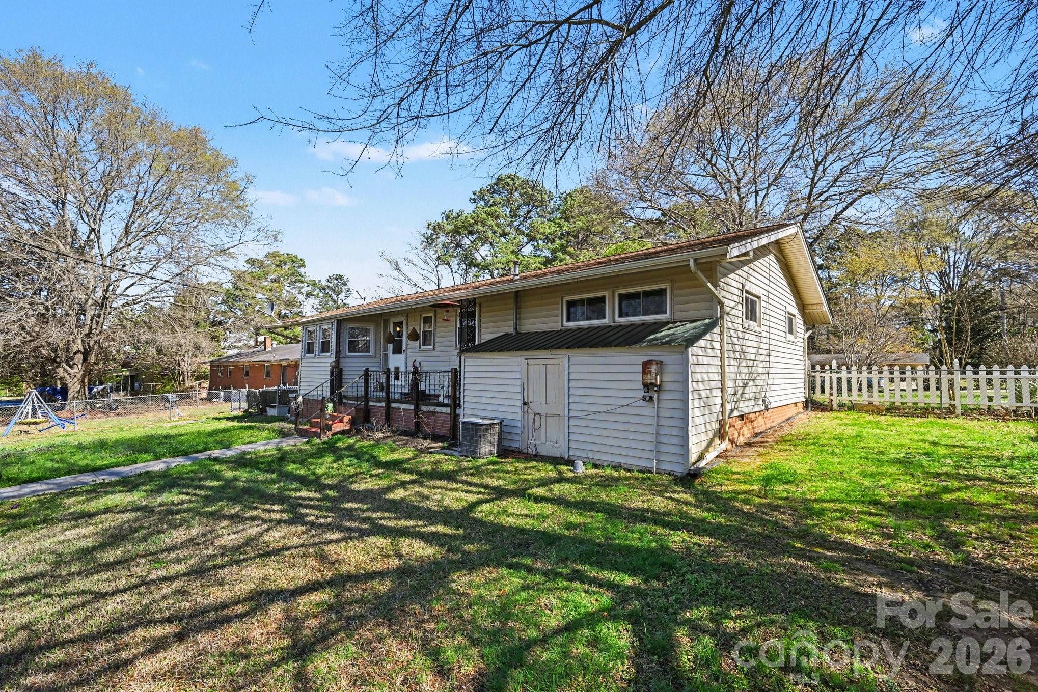 1107 Crestfield Drive Lancaster, SC 29720 - Photo 29 of 29 a view of a house with a yard and plants