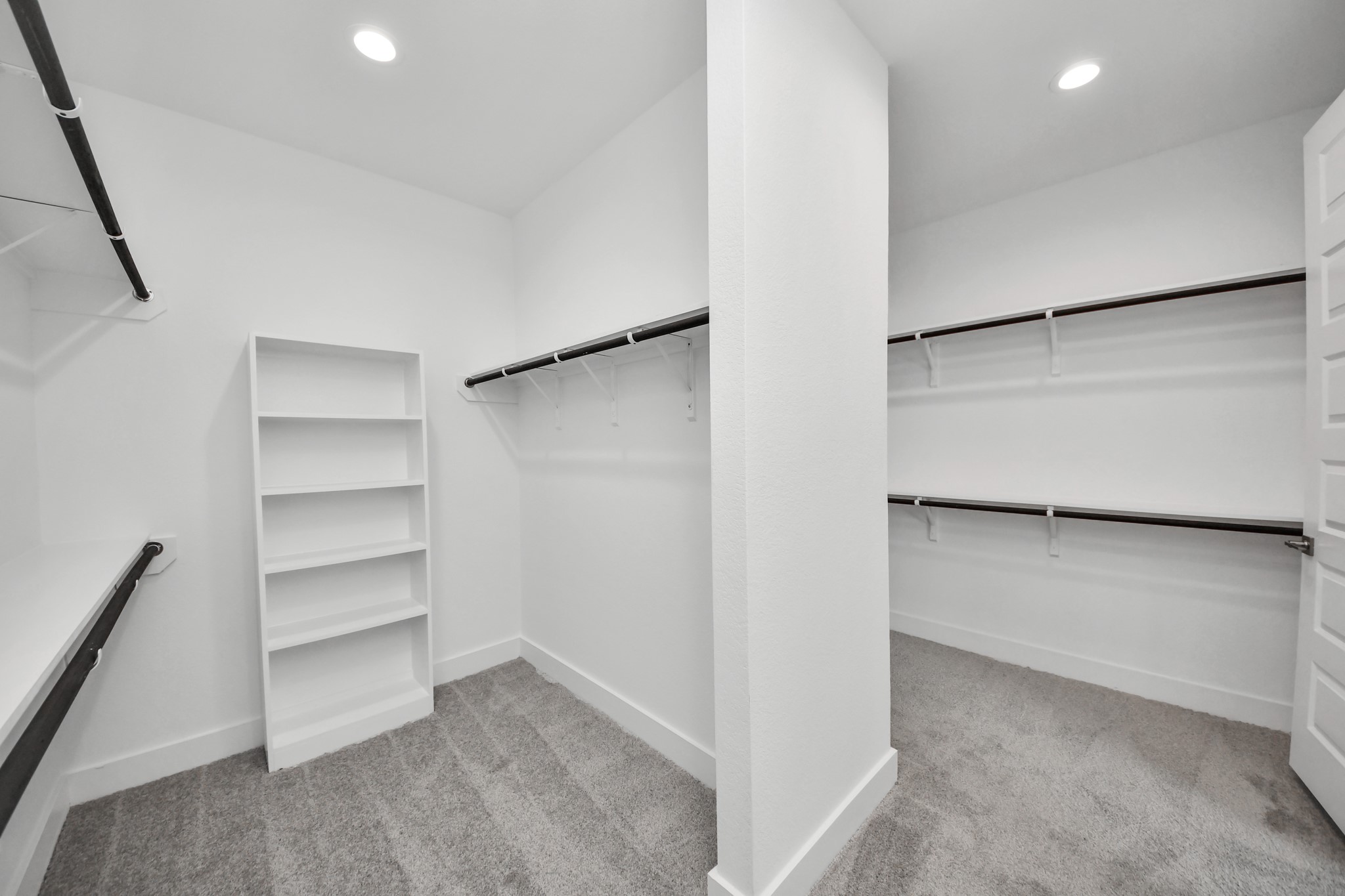 3042 Native Spg Drive Spring, TX 77373 - Photo 33 of 40 Walk-in closet that epitomizes luxury and practicality. This generously sized space features built-in shelving, offering abundant room for impeccable organization. High ceilings and recessed lighting create a bright and welcoming ambiance.